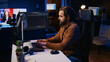 © DC Studio - Computer engineer deliberating ways of fixing errors while developing code on PC. IT professional brainstorming ways of solving database errors, remotely working from home.