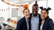 © Jian - Halloween office team celebration three colleagues laughing together at meeting room for corporate newsletter magazine cover workplace culture promotion