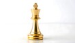 © Nurita - Golden chess king piece standing alone on reflective white surface indoors