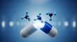 © Rifat - Open capsule releasing blue and light blue molecules on a blue background medicine pill