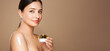© Oleg Gekman - Cropped shot of a young tanned woman moisturizing her shoulder with her hand using a cream isolated on a beige background. Skin care. A white thick spear of cream on the female body