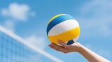 Person holding volleyball against blue sky with net in background