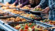 © Pro Hi-Res - Diverse people selecting food from buffet line at office canteen during lunch break