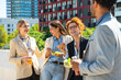 © unai - Diverse business team sharing an outdoor lunch break