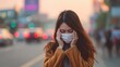 © Dao - Asian woman wearing mask for prevent dusk pm 2.5 bad air pollution and coronavirus or covid-19 having headache, fever. Girl wears mask due to bad smell and prevent virus infection from people in city.