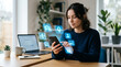 © hr-gold - Woman using smartphone with privacy setting icons in a home office setting