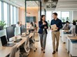 © Aliaksandr Barouski - Employee welcoming new hire with office tour during first day onboarding