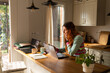 © Alba Vitta Studio/Stocksy - Working From Home at a Kitchen