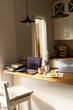© Alba Vitta Studio/Stocksy - Workspace Setup in a Cozy Kitchen