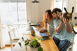 © Alba Vitta Studio/Stocksy - Couple Enjoys Time Together With Cat While Working at Home