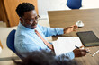 © Boris Jovanovic/Stocksy - Businessman sits on a meeting