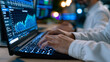 © Maksym - Office worker at standing desk carefully types master password into password manager vault application, security score dashboard displaying significantly improved credential hygiene metrics, coworke