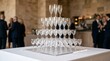 © Olga - Champagne glasses arranged in pyramid shape for celebration event