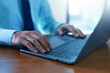 © Suriyo - doctor is typing on a laptop computer to record patient data in the hospital system.