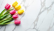 © Inna - colorful tulips arranged on a marble surface, creating a vibrant spring atmosphere for floral design and decoration purposes