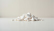 © Inna - white pebbles arranged in a natural formation on a smooth surface against a light background, used for decoration or design purposes