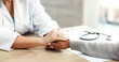 © peopleimages.com - Healthcare, hands and doctor with patient comfort for health diagnosis, medical support and empathy. Professional, women and console in hospital consultation for test results, bad news and follow up