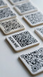© pattozher - QR Codes arranged in a Grid: A collection of QR codes arranged in a systematic grid pattern, with one prominently featuring the text SCAN ME, suggesting digital interaction and connectivity.