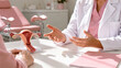 © Victoria - woman gynecologist consulting patient while showing female reproductive system anatomy model. Medical healthcare appointment in clinic. Professional consultation about woman health and fertility