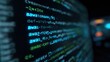 © Saddang - Close-up of computer screen displaying lines of abstract programming code in various light-blue shades. The background is dark