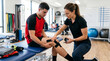 © Thumbs - Physical therapist applying kinesiology tape to athlete's knee