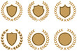 © MDHASAN - Golden laurel wreaths surrounding shield and circle shapes vector silhouette