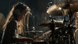 © tati_vision - Young girl playing drums passionately in a music studio. Girl practicing drums with headphones