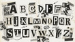 © Googl - Alphabet cutout ransom note style letters on textured paper background