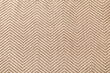 © Pixel-Shot - Natural beige herringbone woven fabric texture background, textile pattern for interior design and upholstery, the close-up view reveals the intricate weave of fibers