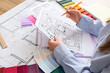 © Pixel-Shot - Architectural design process with blueprint landscape plan color swatches and fabric samples for interior and exterior project planning