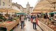 © Pranav - Market stalls filled with fresh vegetables and fruits line a European cobblestone square.