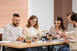 © Pixel-Shot - Group of young people during courses of calligraphy