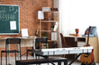 © Pixel-Shot - Music classroom interior with keyboard, guitar, and chalkboard for education and creative learning environment