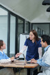 © aekachai - Medical Team Discussing Patient Case and Reports in Hospital Office