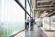 © Westend61 - Two men in factory shop floor examining product