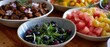 © Mind - A beautiful and healthy brunch buffet spread featuring various fresh salads in rustic ceramic bowls on a wooden table with selective focus.