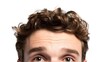 © Алексей Горовой - Young man forehead and messy brown hair isolated on white background, close-up of looking up eyes for skincare and haircut concept