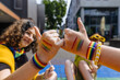 © Westend61 - Friends making pinky promise at outdoor pride parade