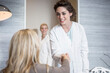 © Westend61 - Dentist greeting patient in lobby
