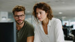 © Phirakhup - Professional team office computer collaboration coworker business focus young adult workplace scene with shared screen analysis