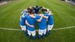 © Kolepfg - Team huddles together on a green field before a match
