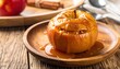© fitristudio - Soft Baked Apple Drizzled with Caramel on Rustic Wooden Plate