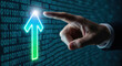 © Tech Pixel - Hand pointing at glowing green and blue upward arrow superimposed on binary code finger touching