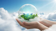 © Lang - Human hands cradling a miniature Earth planet featuring renewable energy wind turbines and solar panels with fresh green leaves under a bright blue sky filled with white clouds.
