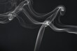© Purple_Monster - Elegant white smoke swirls on dark charcoal background, delicate flowing wisps with copy space