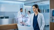 © Faysal - Female Doctor Using AI Healthcare Technology with Holographic Brain Interface, Future Medical Innovation and Digital Health System Concept