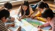 © Photo Moon - Education - Asian Children Drawing Peace Symbols and Smiling Faces on Large World Map Together on Floor