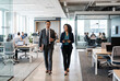 © Meow Creations - Diverse business colleagues walking and talking in modern office
