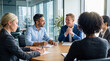 © Athena Studio - Smiling diverse business professionals engaging in a productive corporate meeting, discussing reports and strategies.