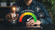 © MdSuhel - Businessman pointing at risk management meter on virtual screen for business control